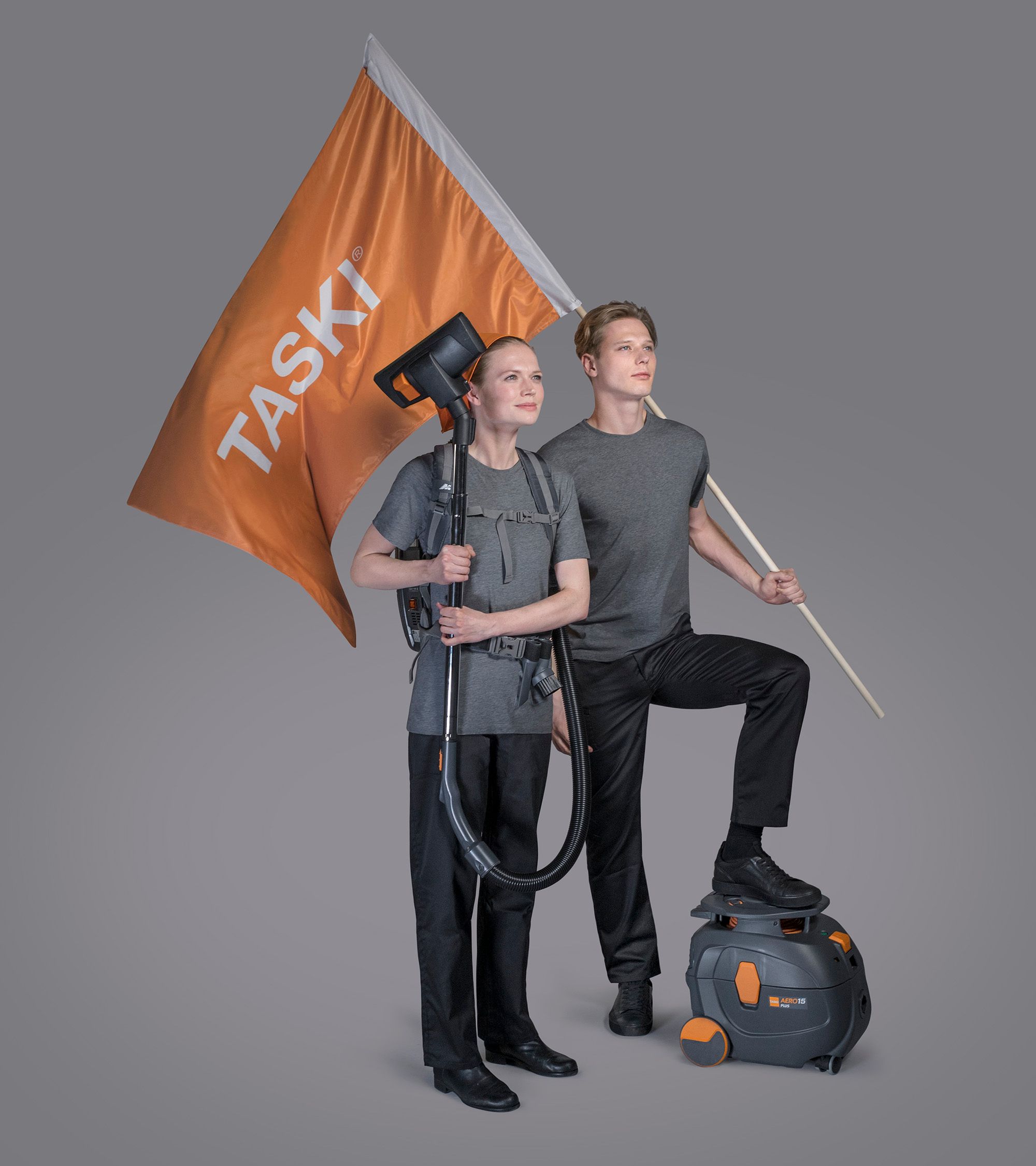 Campaign photography — couple with TASKI AERO in hospitality setting